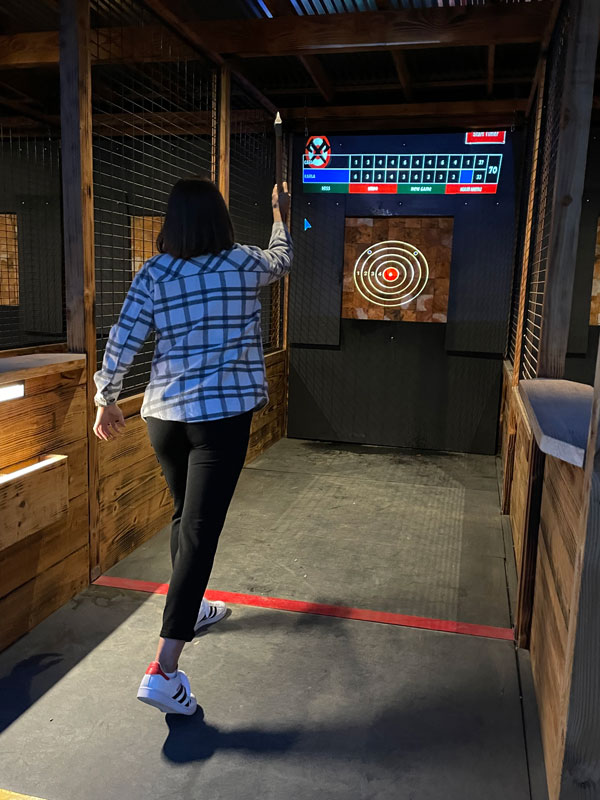 A person enjoying axe throwing in winchester, ca